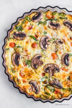 a quiche with cheese, mushrooms and tomatoes