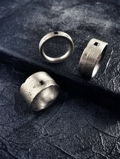 Statement roughness. Raw, pure and edgy surfaces with a strong and grunge look & feel. The handcrafted process make every piece unique, no ring will have the same texture. Forged with sand and fire, your ring will reflect your unique souls. A black zirconia stone is encrusted on the ring as symbol of strength. Dare to wear it, dare to be you.MATERIALS:Textured, oxidized and heavy brushed 925 sterling silver .Black cubic zirconia stone.Each piece is made and finished by hand, for this reason ever Symbol Of Strength, Edgy Jewelry, Iron Ring, Sand Casting, Symbols Of Strength, Grunge Look, Black Textures, Band Ring, Band Rings