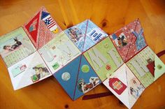 several folded up cards on a wooden table