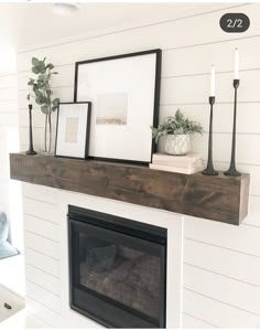 a fireplace mantle with pictures and candles on it