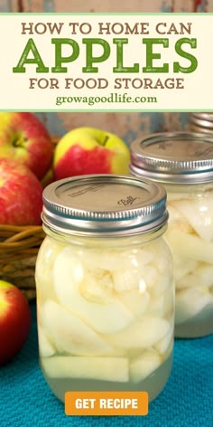 two jars filled with apples sitting on top of a blue table cloth next to an apple basket