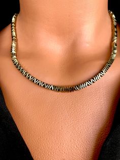 Gold Hematite Choker Necklace Indulge in the charm of this exceptional necklace, a perfect gift for both yourself and your cherished ones. Crafted from natural gemstone beads, adorned with gold-plated metal accents that stand the test of time, ensuring they won't tarnish over the years. FREE SHIPPING - All orders get shipped within 1-2 business days. - 2-5 working days of delivery time Returns are allowed 14 days after the delivery, however, the cost of delivery lies on the buyer. For more brace Couples Christmas Gifts, Choker Necklace Gold, Couples Christmas, Hematite Necklace, Gift For Couples, Metal Accents, Dainty Necklace, Metallic Accents, Necklace Gold