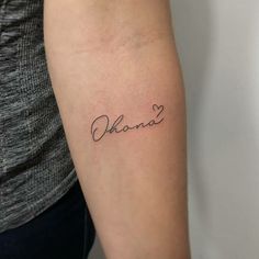 a woman's arm with the word obama written in cursive font on it