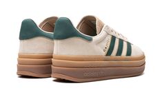 The Women’s adidas Gazelle Bold “Cream White/Collegiate Green” is a women’s-exclusive colorway of the retro sneaker with a stacked midsole and other modifications.  The adidas Gazelle Bold updates the original Gazelle silhouette with a triple-stacked gum rubber midsole, giving the sneaker a decidedly contemporary look.  The upper is complete with a cream suede construction with a tonal suede overlay on the toe.  Collegiate Green leather Three Stripes and gold “Gazelle” branding appear on the sid Gazelle Bold Platform, Gazelle Platform, Adidas Shoes Gazelle, Adidas Sl 72, Classic Adidas, Hippie Style Clothing, Adidas Spezial