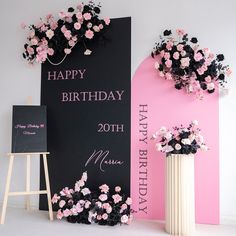 there is a birthday sign and vase with flowers on it