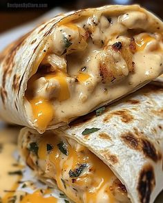 two quesadillas are stacked on top of each other with cheese and sauce