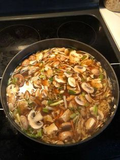 a pan filled with food sitting on top of a stove