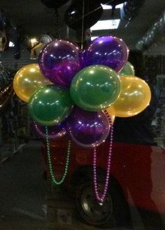 a bunch of balloons hanging from the ceiling