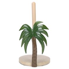 a small palm tree with a wooden stick in it