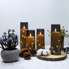 some candles are sitting on a white table