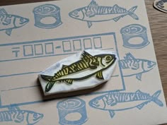 a rubber stamp with a fish on it