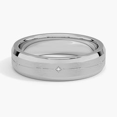 a wedding band with a diamond in the center