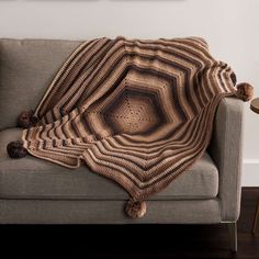 a couch with a blanket on top of it