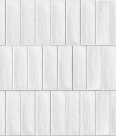 a white tile wall that is very close up