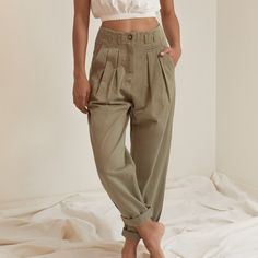 High Waist Cotton Twill Trouser Pant Featuring Pleated Front, Tapered Hem And Slit Pocket Details. Roll Cuff Detail. Olive Color Relaxed Fit 100% Cotton Imported Size Small Waist Approx. 28" Hips Approx. 36" Rise Approx. 14" Inseam Approx. 29" Length Approx. 42" Model Is 5'9" And Wearing Size Small As Seen On Www.Shopceme.Com Cuff Detail, Olive Color, Pleated Pants, Small Waist, Trouser Pants, Pocket Detail, Jeans Pants, Cotton Twill, Pant Jumpsuit