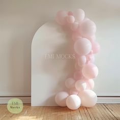 a bunch of balloons that are in the shape of a letter on top of a wall