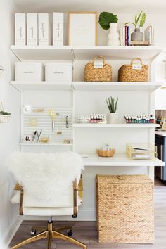 a white chair sitting in front of a desk with baskets on top of it and bookshelves above