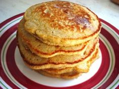 three pancakes stacked on top of each other with syrup drizzled over them