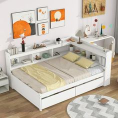 a white bed sitting on top of a wooden floor