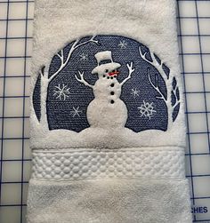 a white towel with a snowman on it