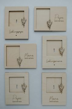 four wooden frames with different designs and names on them, each containing an individual's name