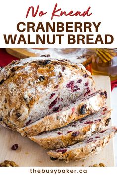 no knead cranberry walnut bread on a cutting board with text overlay