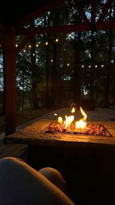 a fire pit is lit up in the dark