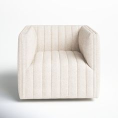 an upholstered chair is shown in white