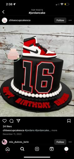 a black and red birthday cake with the number sixteen on it's top layer