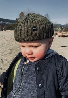 Crafted with double rib knitting, this army green Baby Fisherman Beanie offers a snug and secure fit for your little one's head, keeping them warm during chilly weather conditions. Not only is it practical, but the stylish army green color adds a pop of color to any outfit.   MATERIAL: 50% Merino Wool/ 50% Acrylic One size  Height: 13.5cm (5.3 inch) Width: 17-18cm (7 inch) Rib Knitting, Baby Beanie Hat, Fisherman Beanie, Toddler Beanie, Baby Beanie Hats, Green Baby, Wool Beanie, Baby Head, Chilly Weather