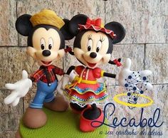 a couple of mickey and minnie mouse figurines