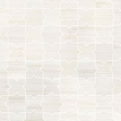 a white tile wall with an abstract pattern