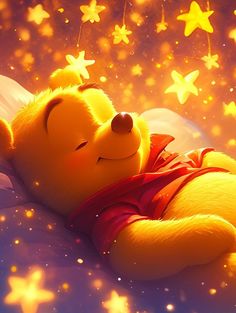 a teddy bear laying on top of a bed next to stars