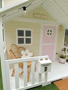 there is a doll house with a porch