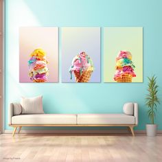 three ice cream posters on a wall in a living room with a couch and potted plant