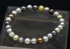 A stretch bracelet consisting of cultured pearls in a variety of different colors. Made by Honora. Bracelet is about 2 1/2 inches diameter unstretched Pearls are about 1/4 inch diameter Cultured Pearls, Stretch Bracelet, Pearl Bracelet, Stretch Bracelets, 4 Inch, Different Colors, Beauty Book, Jewelry Bracelets, Multi Color