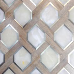 a close up view of a wooden wall with hexagonal tiles