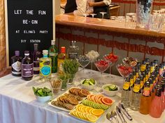 a buffet table filled with lots of food and drinks