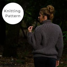 a woman standing in the woods with her back turned to the camera and looking at something