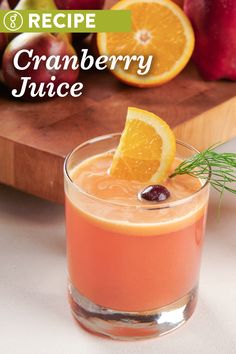 an orange and cranberry juice is garnished with rosemary