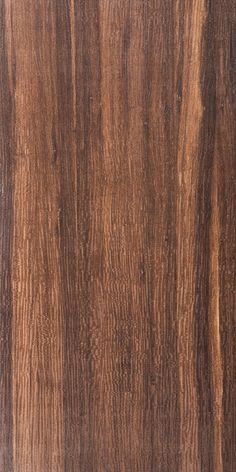 the wood grain is brown and has been stained with dark brown staining on it