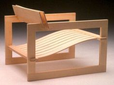 a miniature wooden chair made out of wood