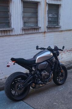 a motorcycle parked in front of a building