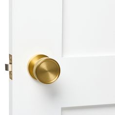 a close up of a door with a gold knob on it's front door