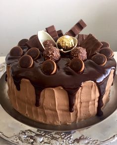 a cake with chocolate icing and candies on top