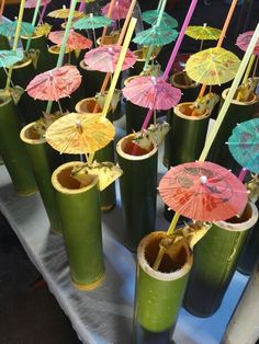 there are many cups with umbrellas in them