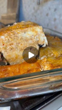 a casserole dish with meat and cheese in it on top of the stove