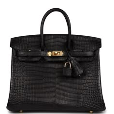 This Birkin is in Black matte porosus crocodile leather with gold hardware and has tonal stitching, front strap, two straps with center toggle closure, clochette with lock and two keys and double rolled handles.The interior is lined with Black chevre and has one zip pocket with an Hermes engraved zipper pull and an open pocket on the opposite side.Collection: UOrigin: FranceCondition: New and never (Plastic on hardware)Accompanied by: Hermes box, Hermes dustbag, clochette, lock, two keys, clochette dustbag, rainhat, care booklet, CITES and feltMeasurements: 10" width x 7.5" height x 4.75" depth; 2.75" handle drop Birkin 25 Black, Hermes Handbags, Crocodile Leather, Black Matte, Hermes Birkin