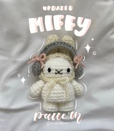 a crocheted stuffed animal wearing a knitted hat and scarf with the words, update miffy on it