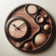 a wooden clock with different shapes and sizes on the face is shown against a white wall